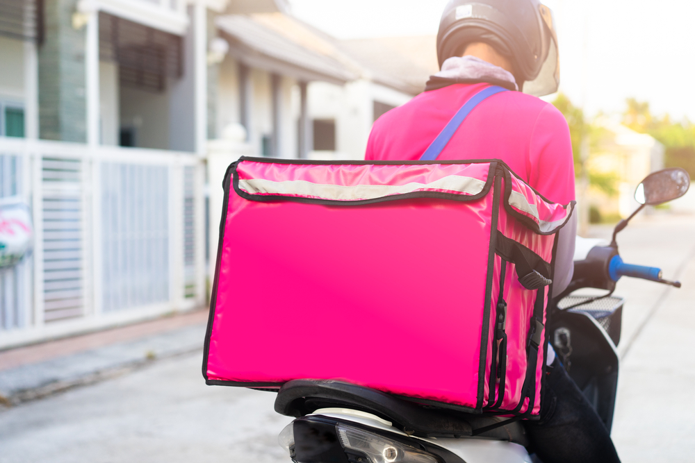 Motorbike,Delivery,Man,Wearing,Pink,Uniform,And,Ready,To,Send